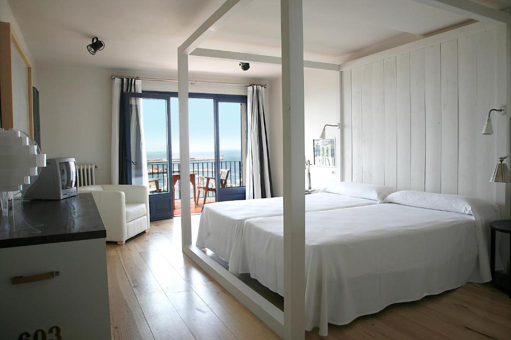 Postel nebo postele na pokoji v ubytování Hotel Trias