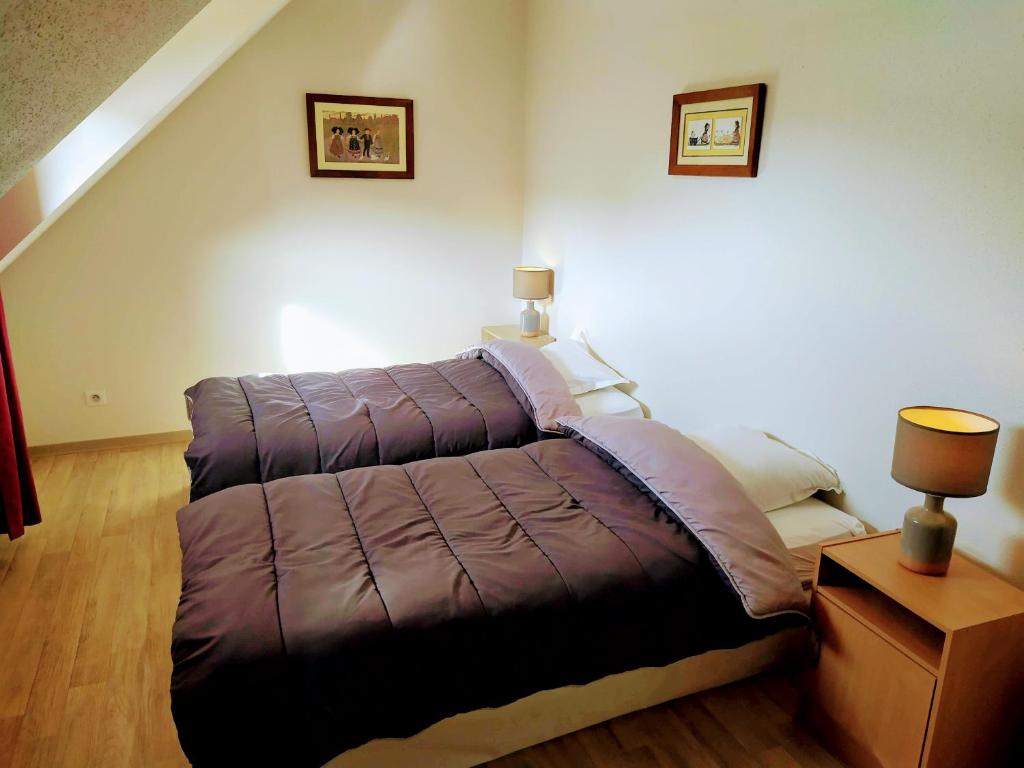 Postel nebo postele na pokoji v ubytování Alsace Appartements Meyer-Krumb