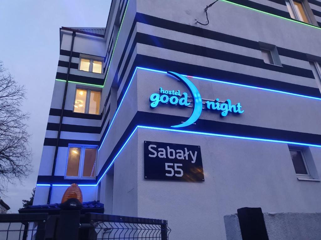 a sign on the side of a building at Good Night in Warsaw