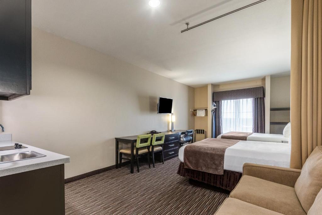 Postel nebo postele na pokoji v ubytování Residency Suites
