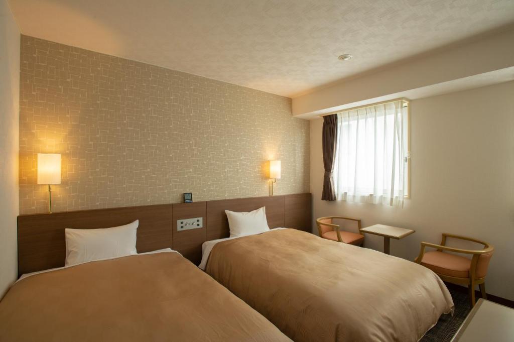 Postel nebo postele na pokoji v ubytování Hotel Yassa