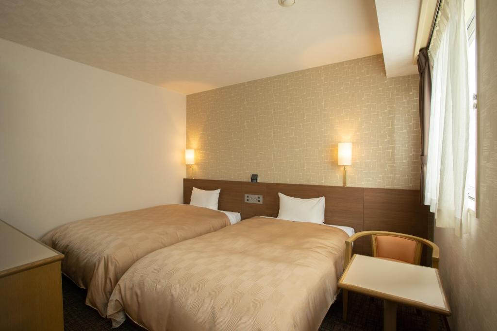 Postel nebo postele na pokoji v ubytování Hotel Yassa
