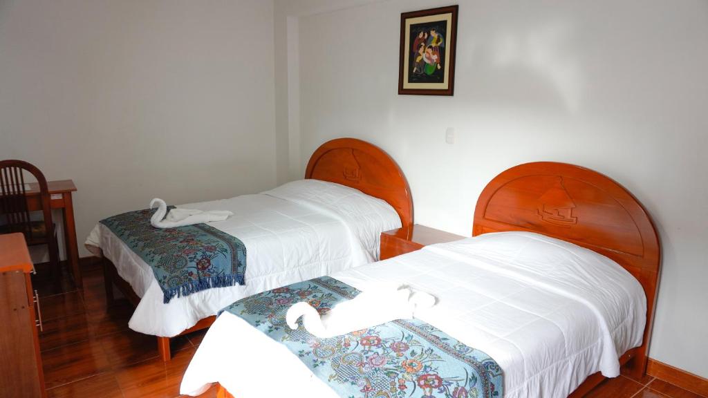 Postel nebo postele na pokoji v ubytování Casa Kuelap Hostal