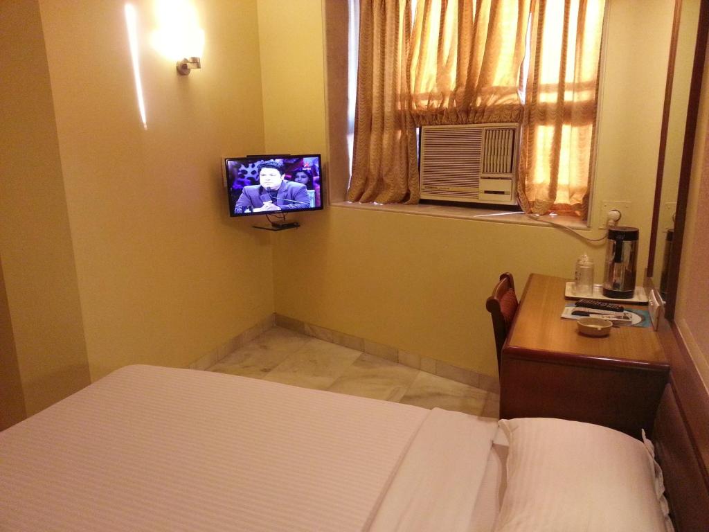 TV a/nebo společenská místnost v ubytování Hotel Ashray International, Sion - Near BKC
