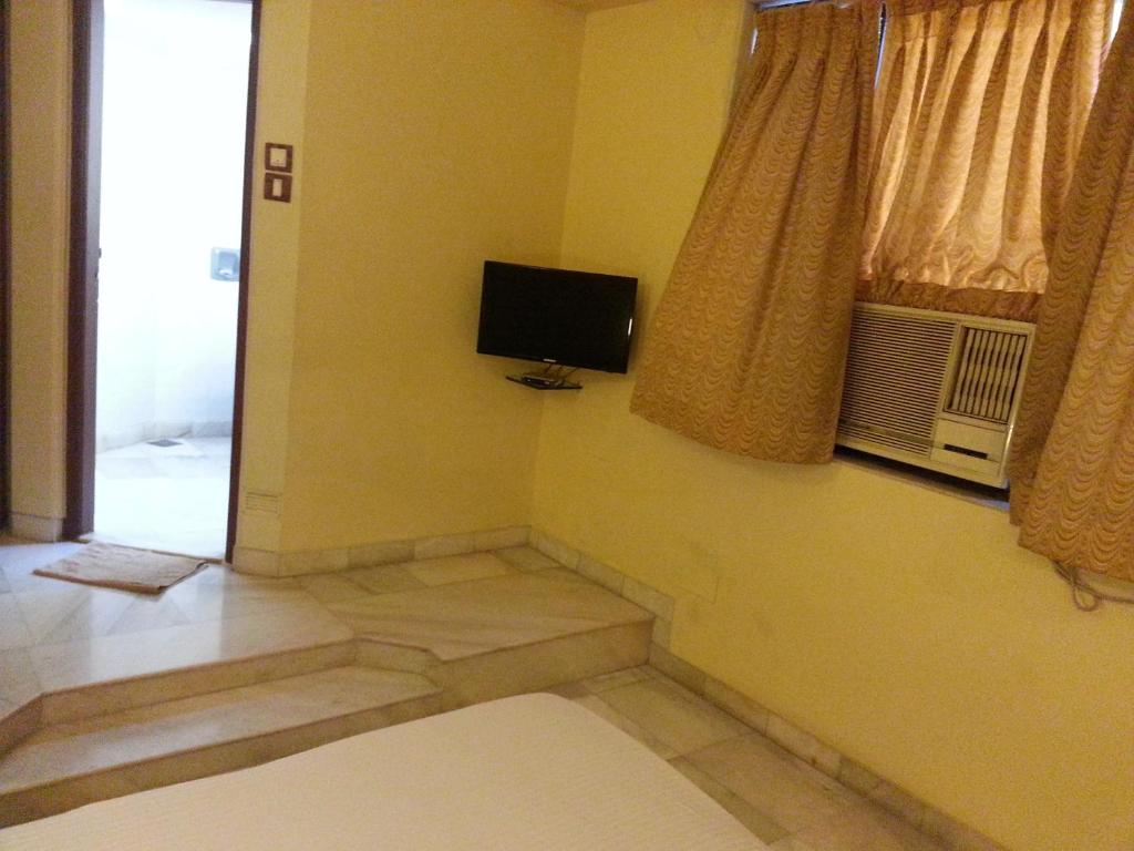 TV a/nebo společenská místnost v ubytování Hotel Ashray International, Sion - Near BKC