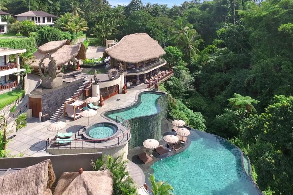 an aerial view of a resort with a swimming pool at Aksari Resort Ubud by Ini Vie Hospitality in Tegalalang