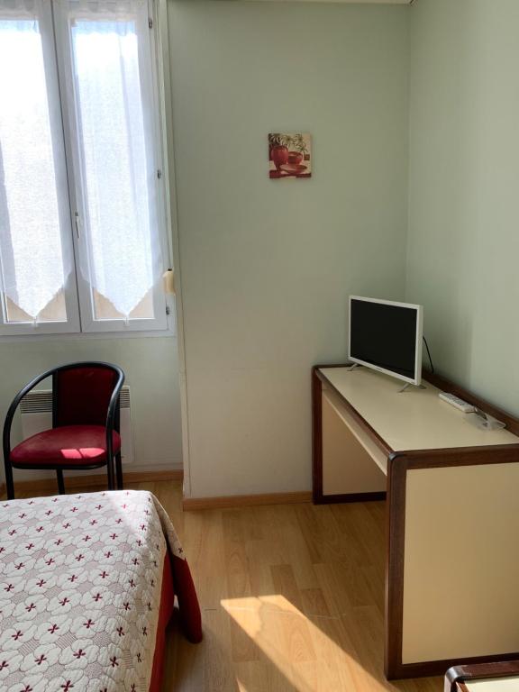TV a/nebo společenská místnost v ubytování Pub vauban terreaux