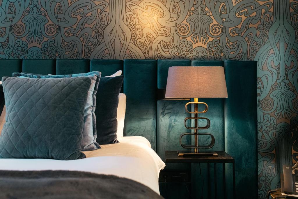 Postel nebo postele na pokoji v ubytování Hotel Britannique