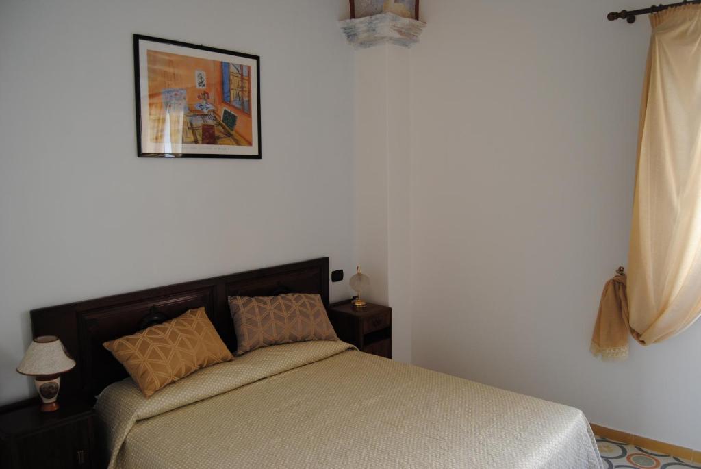 A bed or beds in a room at B & B Palazzo Maestro & Corte Maestro rooms