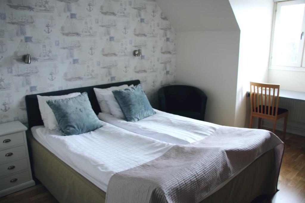Ένα ή περισσότερα κρεβάτια σε δωμάτιο στο Hotel Carlshamn
