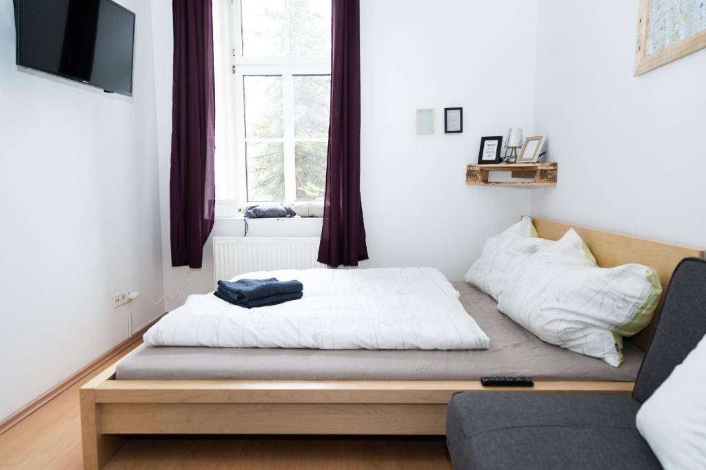 Posteľ alebo postele v izbe v ubytovaní Cozy & quiet Apartment close to Hauptbahnhof Graz