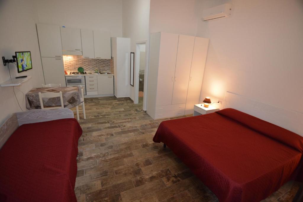 Łóżko lub łóżka w pokoju w obiekcie Residence L'Ulivo