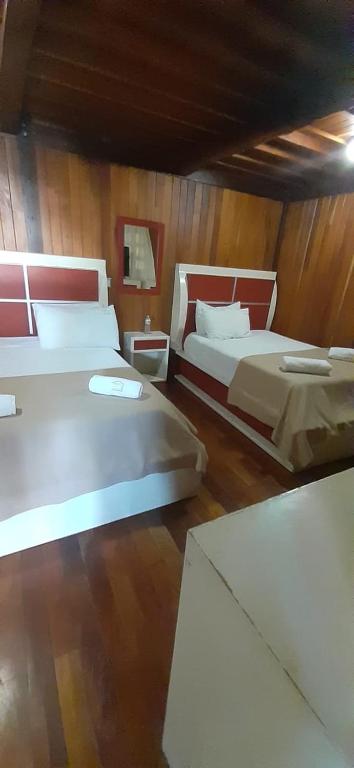 Postel nebo postele na pokoji v ubytování Cabañas La Finca