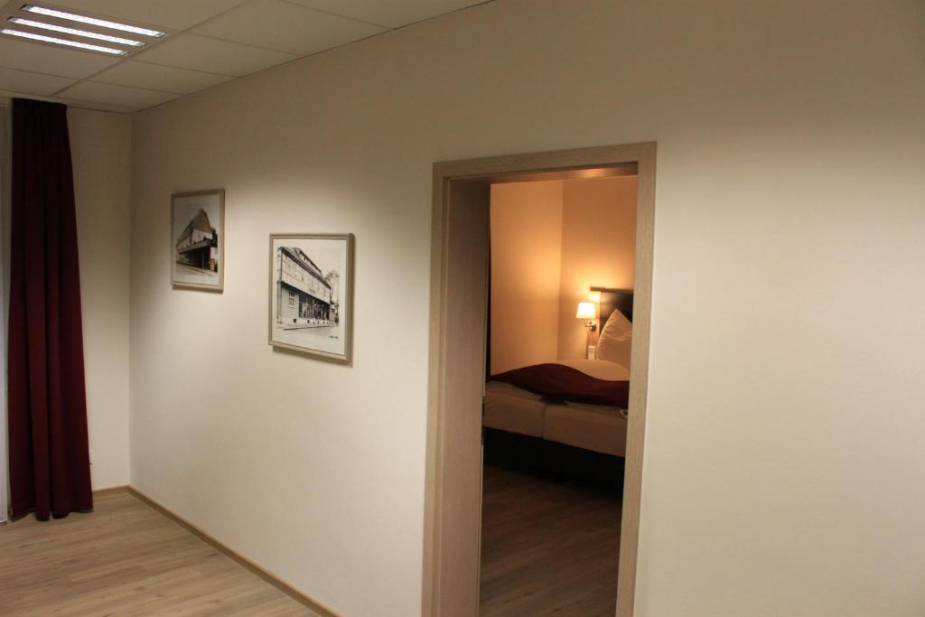 Postel nebo postele na pokoji v ubytování Troll's Brauhaushotel