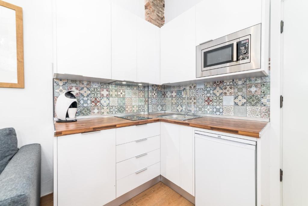 Kuchyň nebo kuchyňský kout v ubytování Suite Homes Uncibay Square