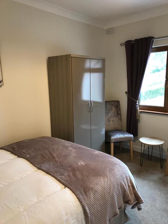 Postel nebo postele na pokoji v ubytování Ros Dún House