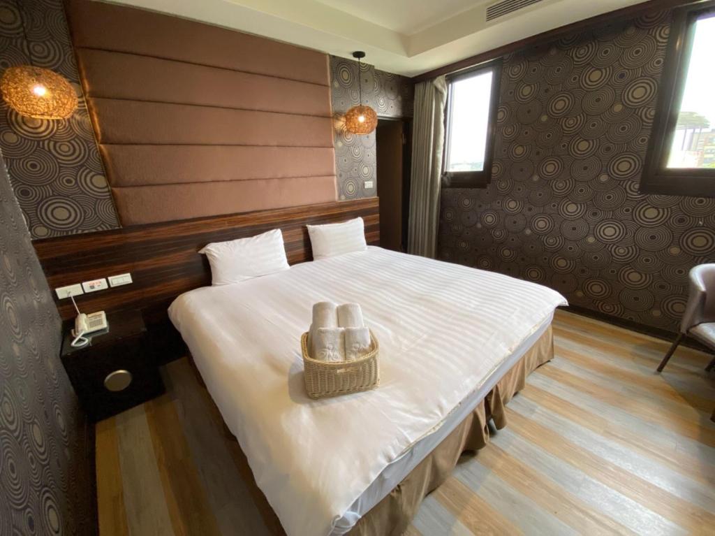 Postel nebo postele na pokoji v ubytování IN99 Hotel