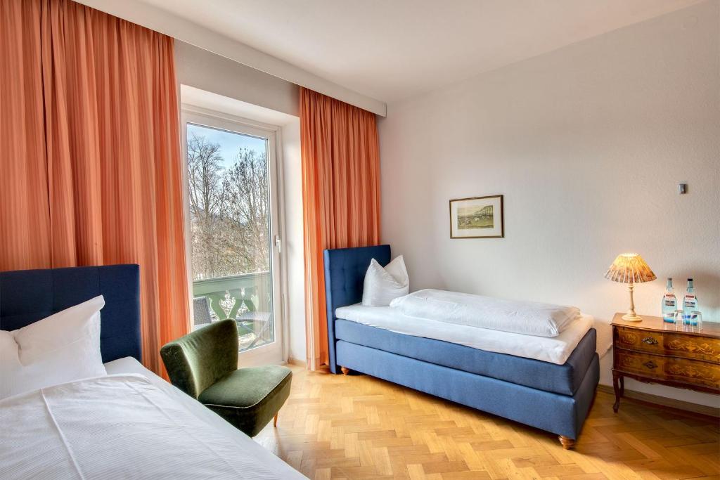Postel nebo postele na pokoji v ubytování Hotel Kolbergarten