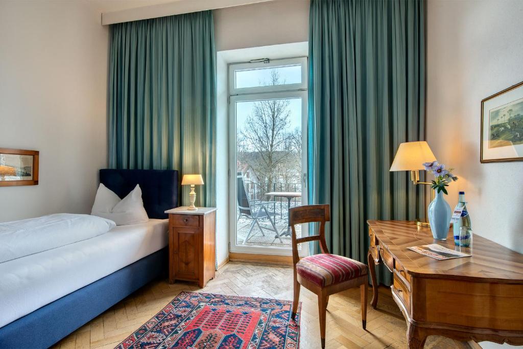 Postel nebo postele na pokoji v ubytování Hotel Kolbergarten