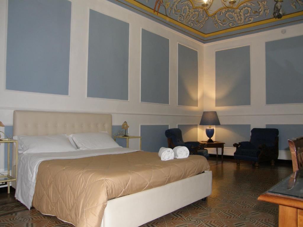 
A bed or beds in a room at Il Gattopardo House

