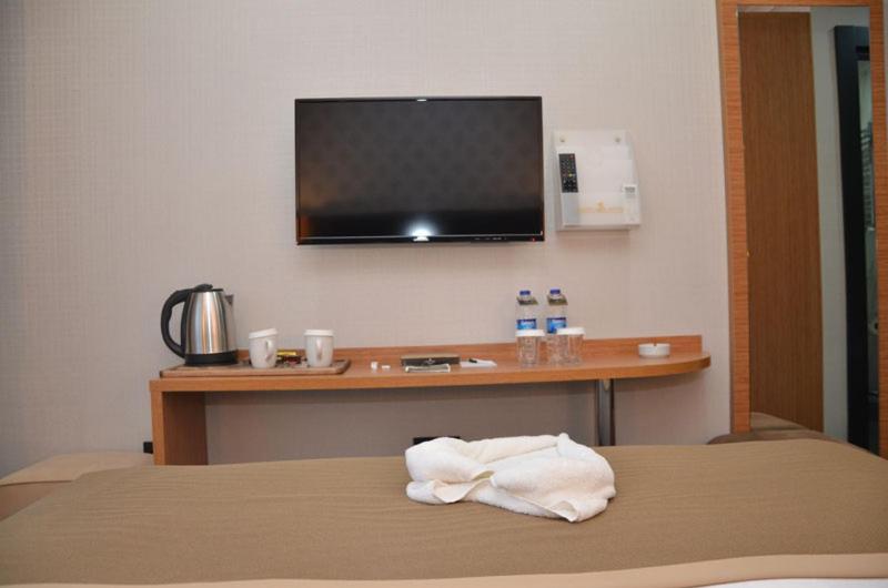 A bed or beds in a room at Otel Grand Lark İstanbul