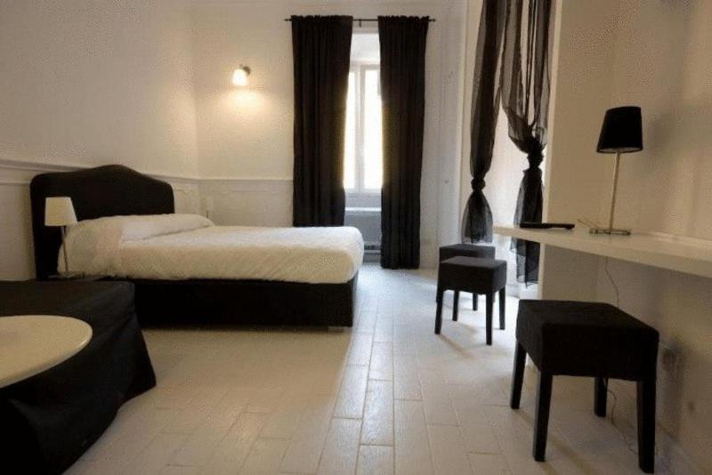 Posteľ alebo postele v izbe v ubytovaní Intra' Residenza in Trastevere