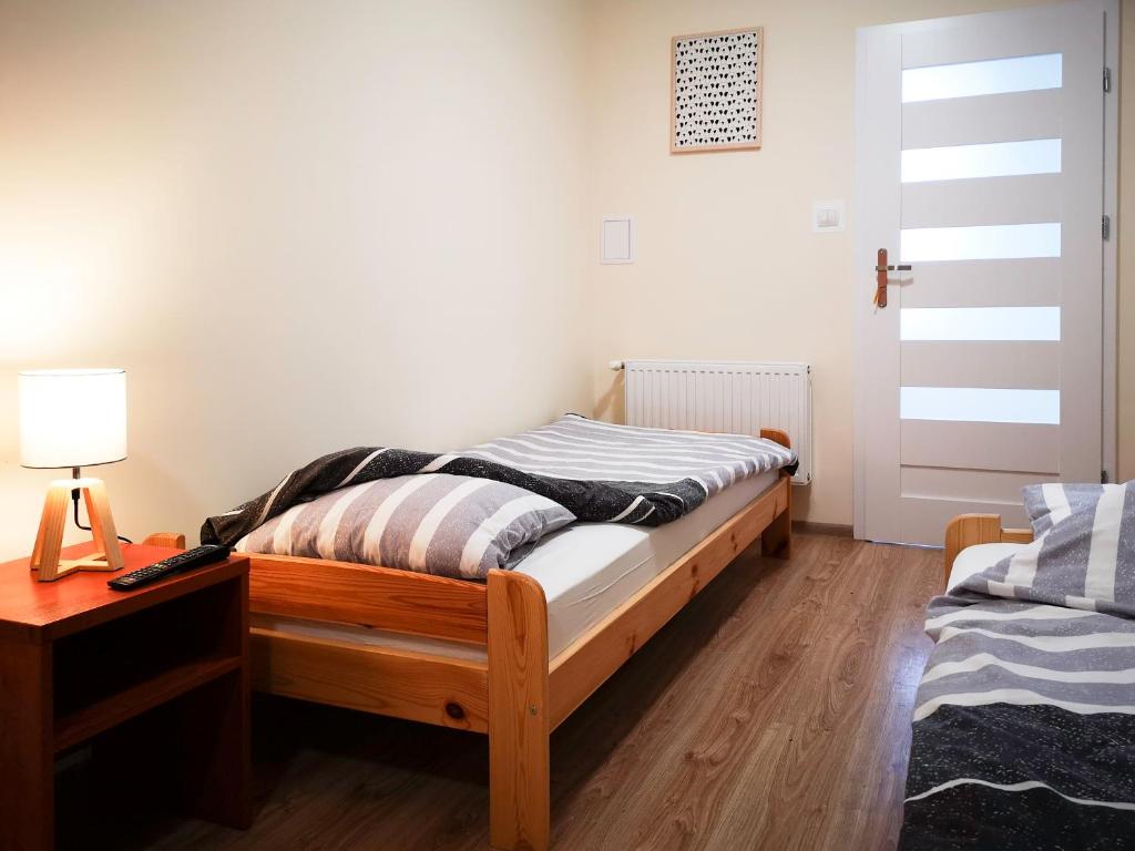 Łóżko lub łóżka w pokoju w obiekcie Ośrodek Wypoczynkowo-Rehabilitacyjny TPD