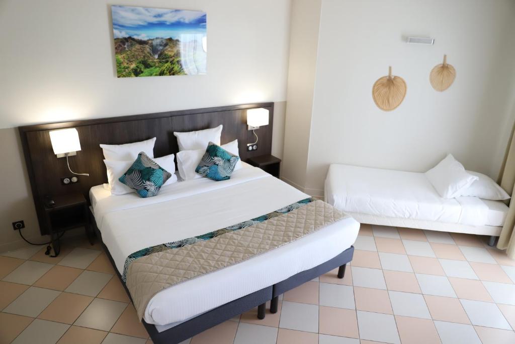 Postel nebo postele na pokoji v ubytování Hôtel Saint-Georges