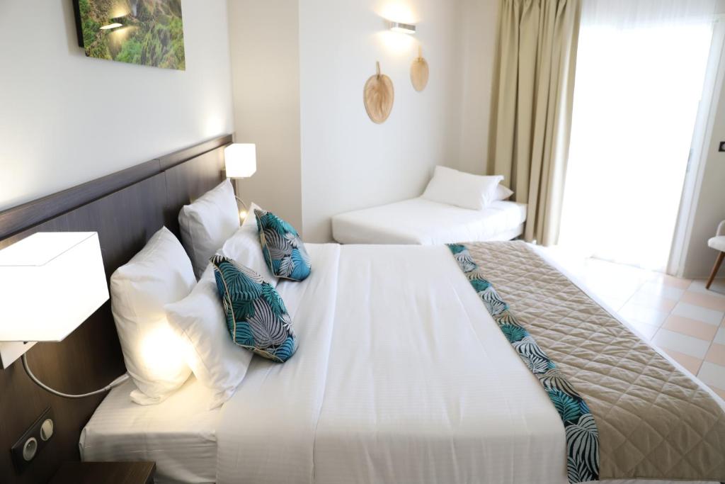 Postel nebo postele na pokoji v ubytování Hôtel Saint-Georges