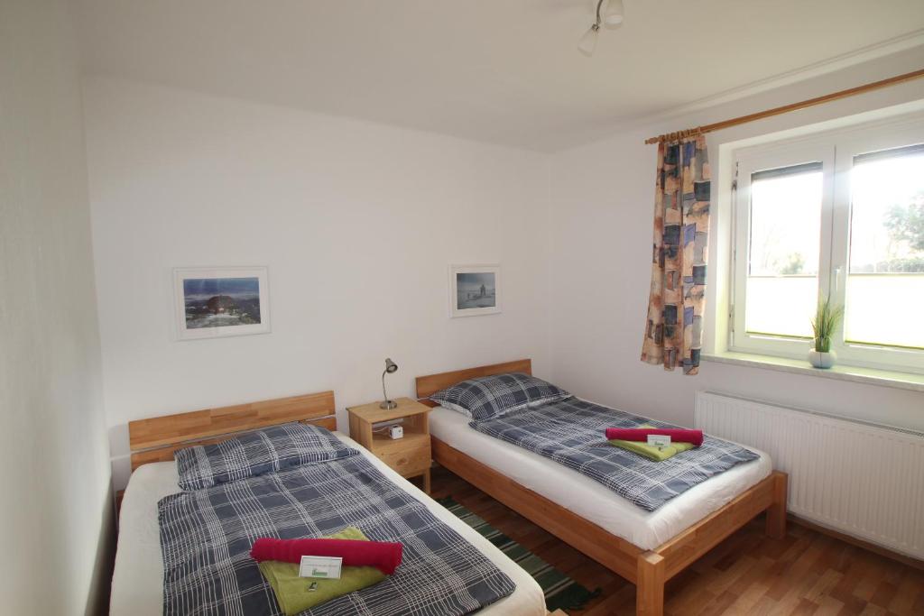 Postel nebo postele na pokoji v ubytování HH-Apartments