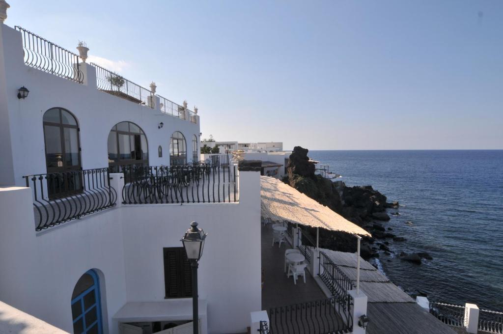 a white building with a view of the ocean at Hotel Villaggio Stromboli - isola di Stromboli in Stromboli