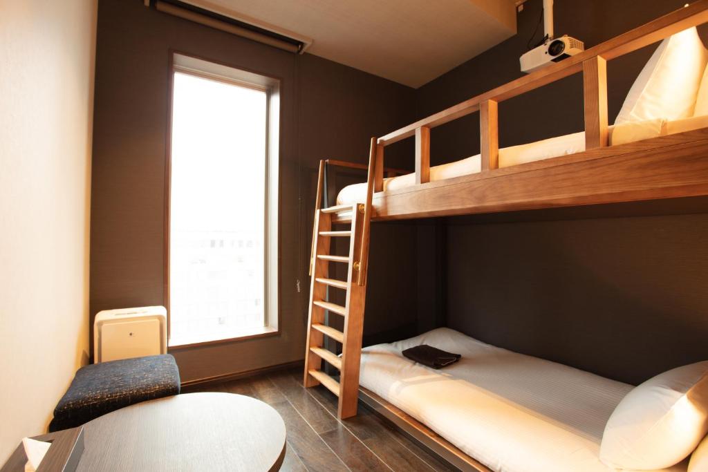 Postel nebo postele na pokoji v ubytování JHotelTokyoGEO