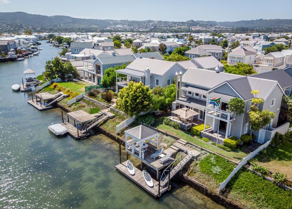 an aerial view of a home with a marina at Canal Waterside Lifestyle on Thesen Islands in Knysna