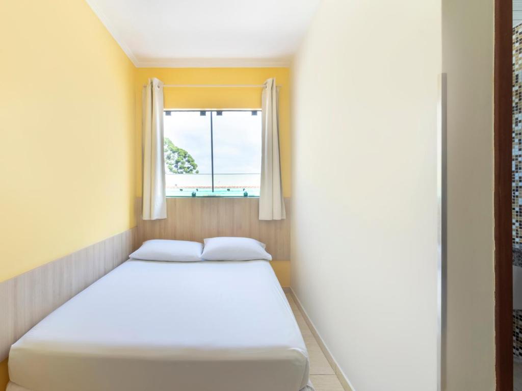 Cama ou camas em um quarto em Hotel Cabbu
