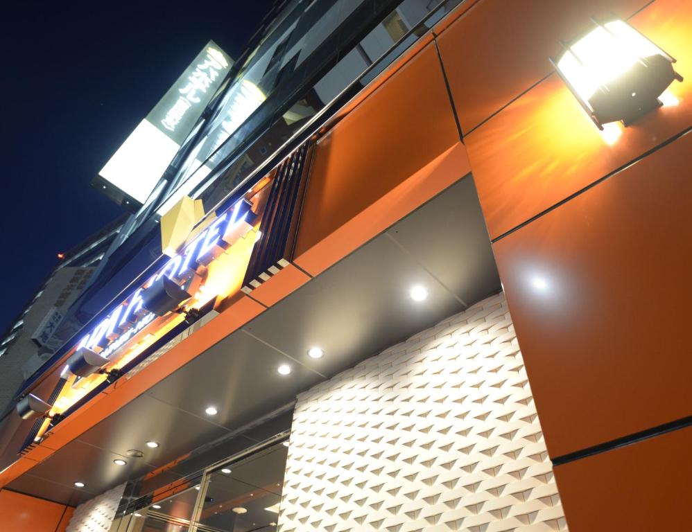 a building with lights on the side of it at APA Hotel Kamataeki-Higashi in Tokyo