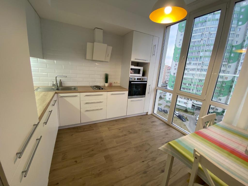 Kuchyň nebo kuchyňský kout v ubytování Scandinavian apartment на Марсельской