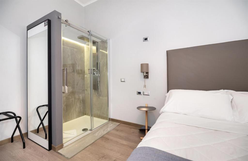 A bed or beds in a room at Clementi 18 Suites Rome