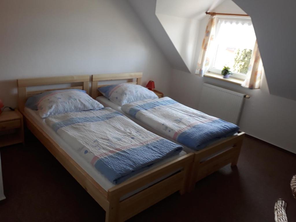 Postel nebo postele na pokoji v ubytování Penzion HORTENZIE
