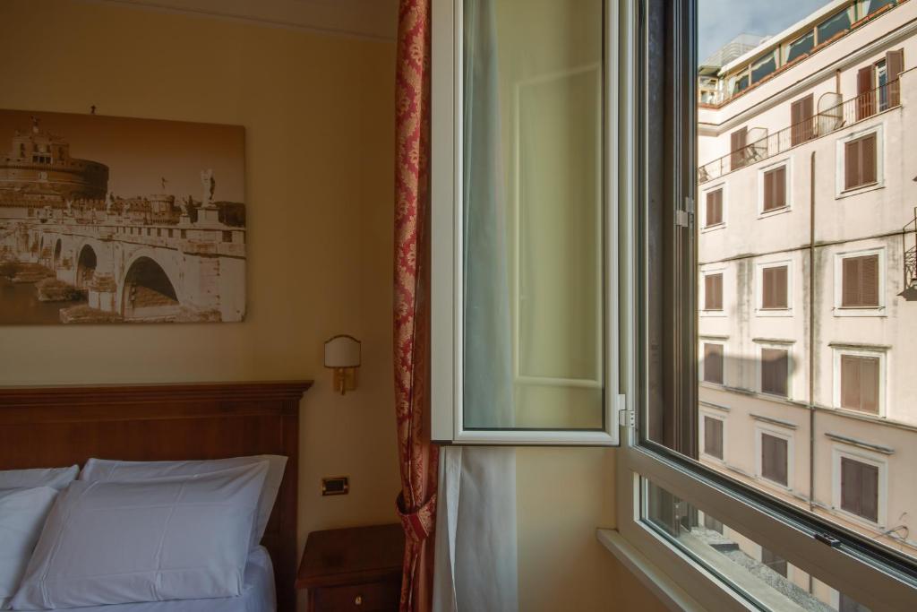 Postelja oz. postelje v sobi nastanitve Hotel RomAntica