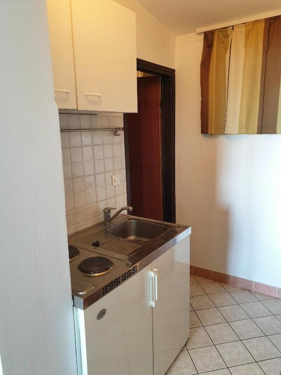 Kuchyň nebo kuchyňský kout v ubytování Family Bungalow Pineta