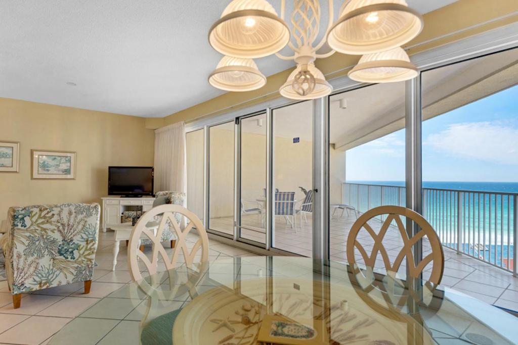 a dining room with a view of the ocean at TOPS'L Tides II in Destin