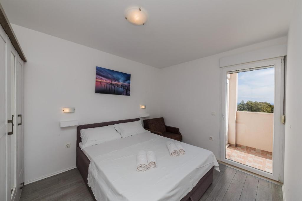 Postel nebo postele na pokoji v ubytování Villa Luana