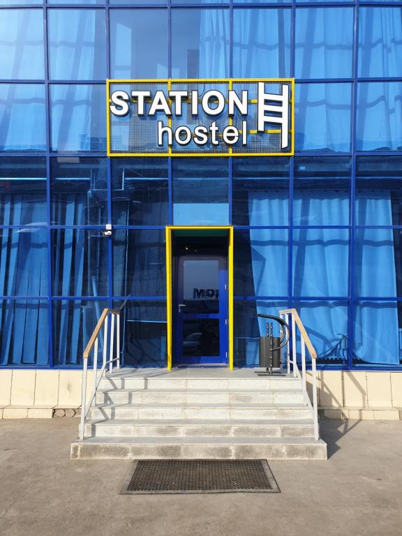 a building with a sign that reads station hospital at Station Hostel in Atyrau