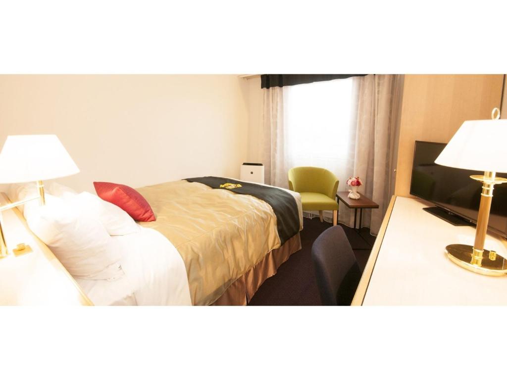 מיטה או מיטות בחדר ב-Grand Park Hotel Panex Hachinohe / Vacation STAY 77784