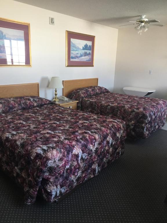 Postel nebo postele na pokoji v ubytování Almada Inn