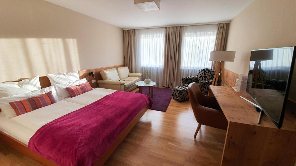 Postel nebo postele na pokoji v ubytování Maxhotel