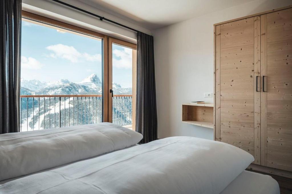 A bed or beds in a room at Sartu Apartments