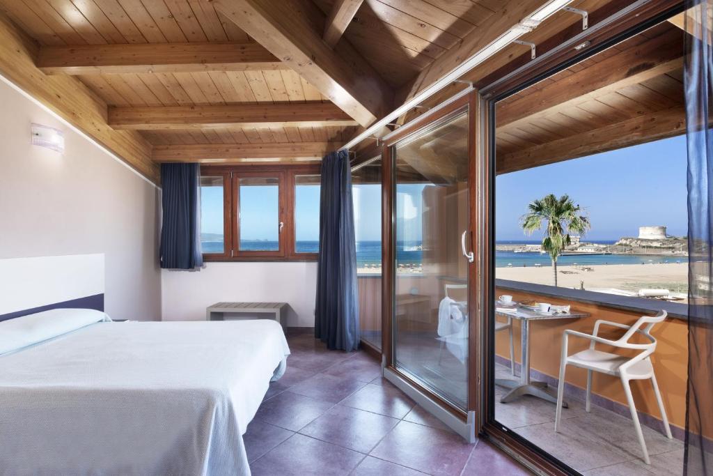 Postel nebo postele na pokoji v ubytování Hotel Al Gabbiano