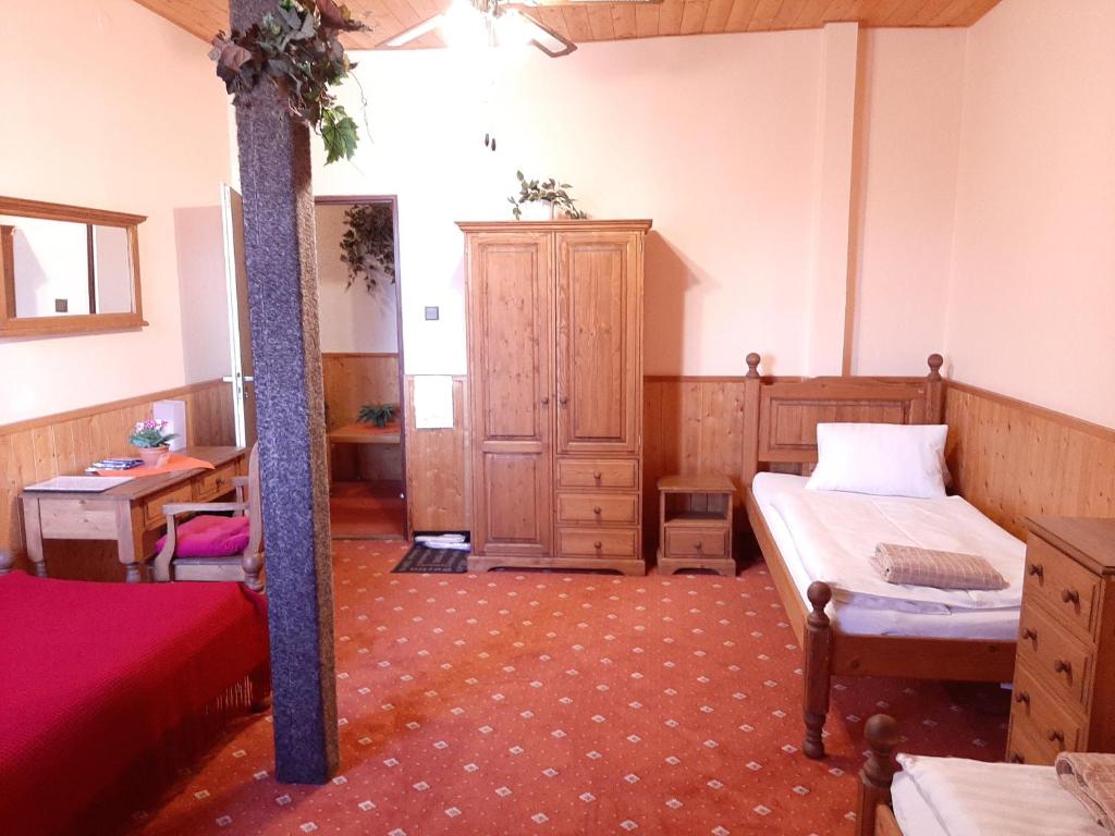 Postel nebo postele na pokoji v ubytování garni Hotel ASAS***