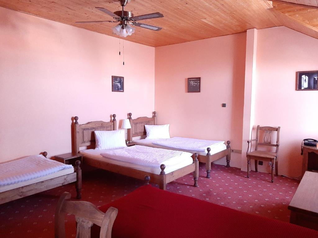 Postel nebo postele na pokoji v ubytování garni Hotel ASAS***